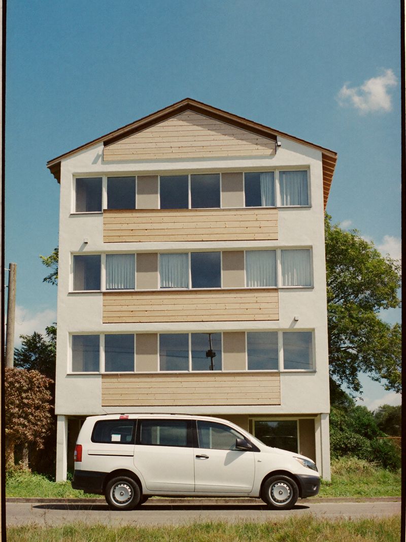 Modern aparthotel with timber cladding in a green suburb